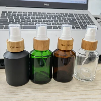 Персонализирано лого стъклена спрей бутилка с бамбуков капак за козметика Лосион за грижа за кожата Опаковка за крем контейнер